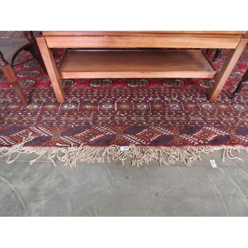 2235 - A red and blue ground rug, tasselled ends   345 X 285cm