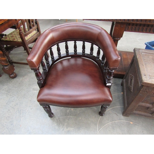 2238 - A Victorian mahogany framed desk armchair upholstered in brown studded leather