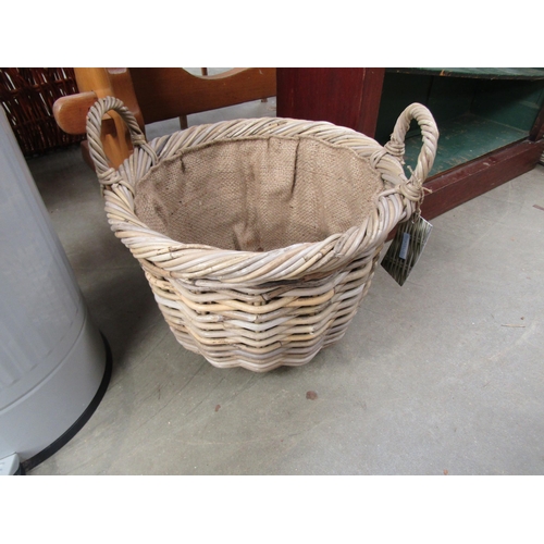 2318 - A wicker twin handle basket, hessian lined