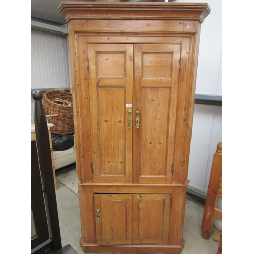 2367 - A Georgian pine three door corner cupboard with shaped shelved interior   (R)  £200