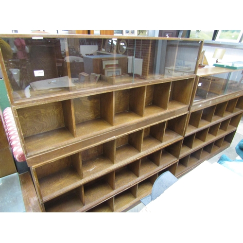 2409 - A pair of 1950's Unix oak stacking bookcase of five sections of two bases