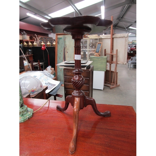 2423 - A mahogany wine table with shaped floral top