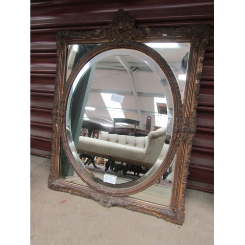 2442 - An ornate 19th Century rectangular wall mirror with oval mirror plate