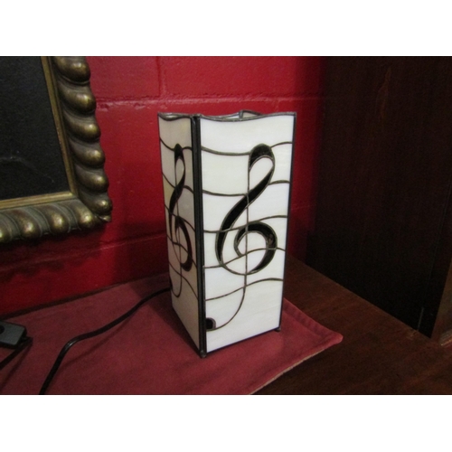 2252 - A Tiffany style lead glazed melody lamp, 27cm high   (C)