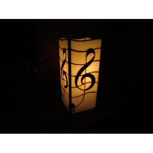 2252 - A Tiffany style lead glazed melody lamp, 27cm high   (C)