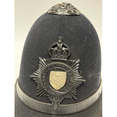 9256 - A Norfolk Constabulary police helmet, rose top, King’s crown badge, leather liner