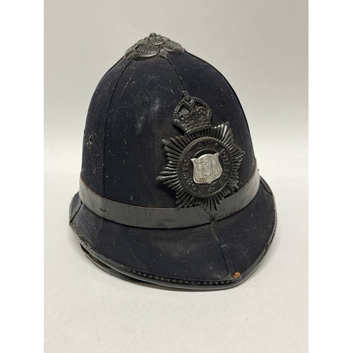 9265 - A Norwich City Police helmet, rose top, King’s crown badge, liner and strap present, worn