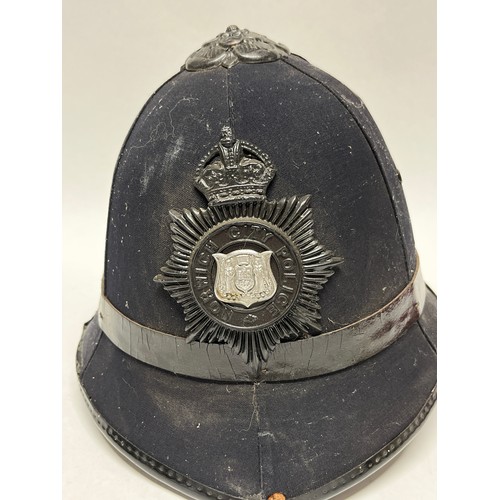 9265 - A Norwich City Police helmet, rose top, King’s crown badge, liner and strap present, worn