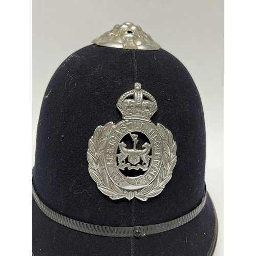 9258 - A Newcastle Upon Tyne police helmet, King’s crown badge, rose top, liner and chinstrap present