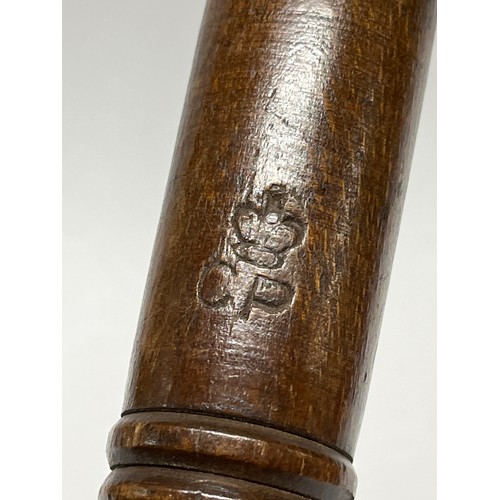 9177 - An early 20th Century hardwood policeman’s truncheon with ribbed grip, stamped CP with crown, leathe... 