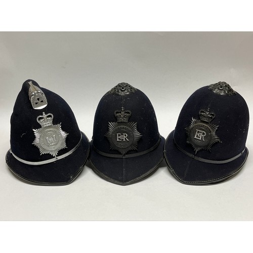 9392 - Five various British police helmets including Metropolitan, Gloucestershire and East Suffolk