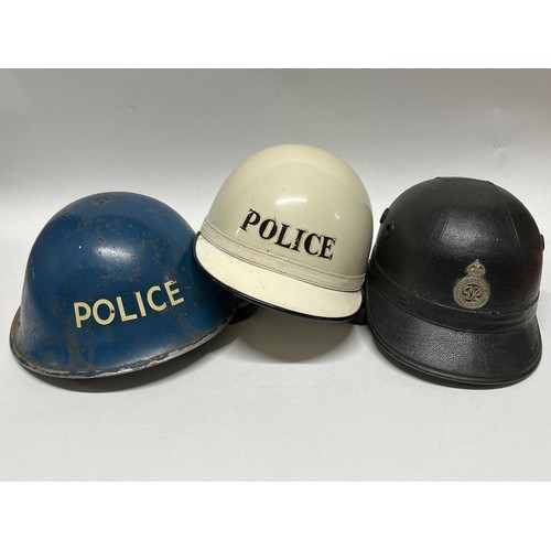 9385 - A vintage Rotherham Borough Police motorcycle helmet, with King’s Crown badge, together with a white... 