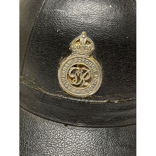 9385 - A vintage Rotherham Borough Police motorcycle helmet, with King’s Crown badge, together with a white... 