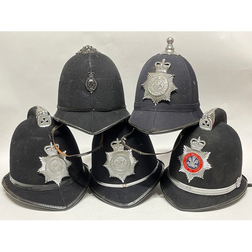 9317 - Five various police helmets including West Yorkshire, North and South Wales and Nottingham City