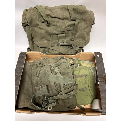 9050 - Two boxes of mixed headwear and webbing including post war British and German