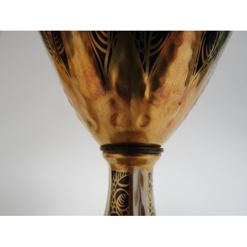 6223 - A pair of Royal Crown Derby Imari pattern urns, ovoid form with fixed knop cover and two high loop h... 