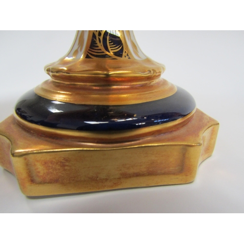 6223 - A pair of Royal Crown Derby Imari pattern urns, ovoid form with fixed knop cover and two high loop h... 