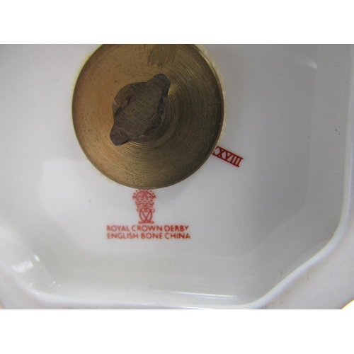 6223 - A pair of Royal Crown Derby Imari pattern urns, ovoid form with fixed knop cover and two high loop h... 