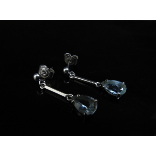 6231 - A pair of 18ct white gold pear shaped aquamarine drop earrings (2.13ct) 2.8cm drop, 2.7g, with sale ... 