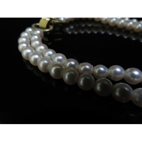 6249 - A double stranded pearl necklace 19cm long, diamond encrusted clasp, 42cm long    (R) £200