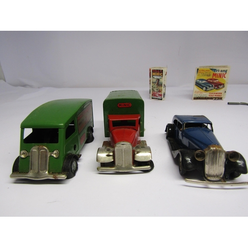 7090 - Four unboxed Triang Minic clockwork vehicles to include armoured car (damaged), two Minic Transport ... 