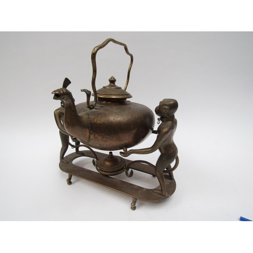 6203 - An Edwardian brass Indian Colonial spirit kettle with standing monkey support, engraved decoration, ... 