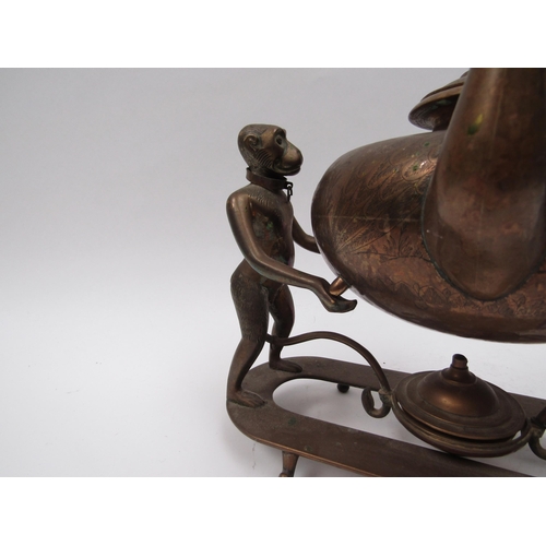 6203 - An Edwardian brass Indian Colonial spirit kettle with standing monkey support, engraved decoration, ... 