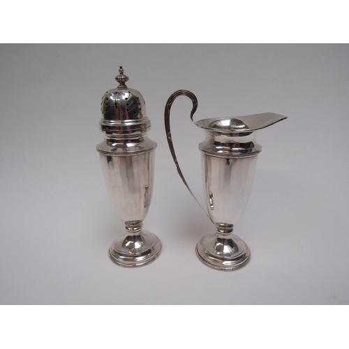 6273 - A Walker and Hall silver two piece sugar castor and cream jug set, Rd 713654 Sheffield 1963, cased, ... 