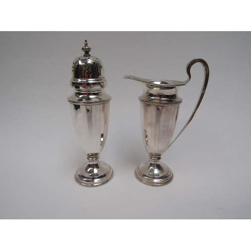6273 - A Walker and Hall silver two piece sugar castor and cream jug set, Rd 713654 Sheffield 1963, cased, ... 