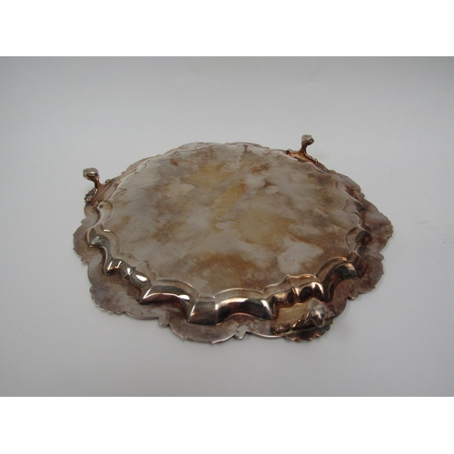 6274 - A Thomas Badbury & Sons silver waiter with scallop edge raised on three claw and ball feet, London 1... 