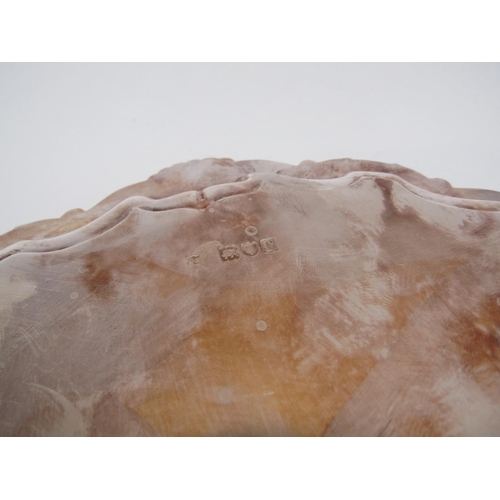 6274 - A Thomas Badbury & Sons silver waiter with scallop edge raised on three claw and ball feet, London 1... 