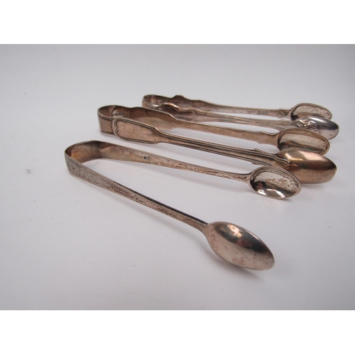 6281 - A silver pin dish and three pairs of silver sugar tongs, various makers and dates, 206g