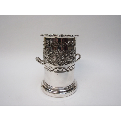 6393 - A silver plated repousse bottle holder with dionysus mask decoration, scrolling vines etc, 19.5cm ta... 