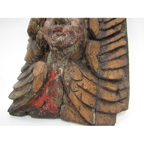 6009 - A 17th Century polychrome, carved wood Angel corbel, 30cm x 28cm