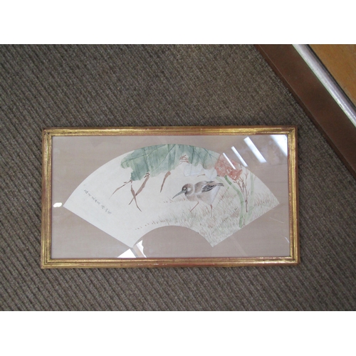 6055 - A Japanese watercolour depicting a wading bird, fan form, character marks to left hand side. 24cm x ... 