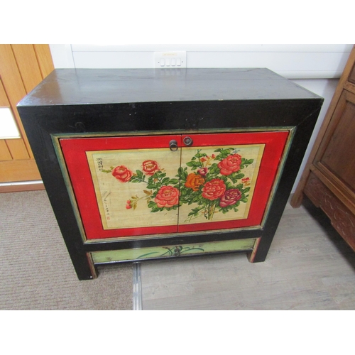 6063 - An Oriental painted two door cupboard with single drawer, floral painted detail, 89cm x 98cm x 46cm