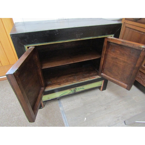 6063 - An Oriental painted two door cupboard with single drawer, floral painted detail, 89cm x 98cm x 46cm