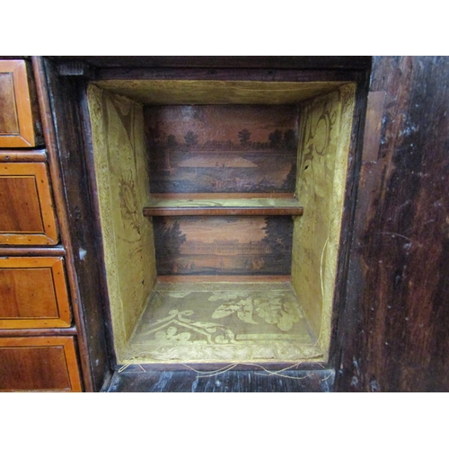 6067 - A William & Mary burr walnut veneered cabinet on chest, ogee pediment over single top drawer. The do... 