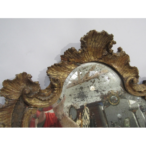 6069 - An 18th Century gilded German mirror frame with acanthus and scroll detail with later glass. Client ... 