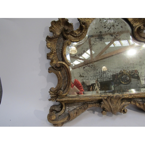 6069 - An 18th Century gilded German mirror frame with acanthus and scroll detail with later glass. Client ... 