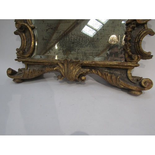 6069 - An 18th Century gilded German mirror frame with acanthus and scroll detail with later glass. Client ... 