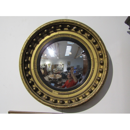 6073 - A 19th Century Regency gilt circular mirror with ball detail 40cm diameter, damage present