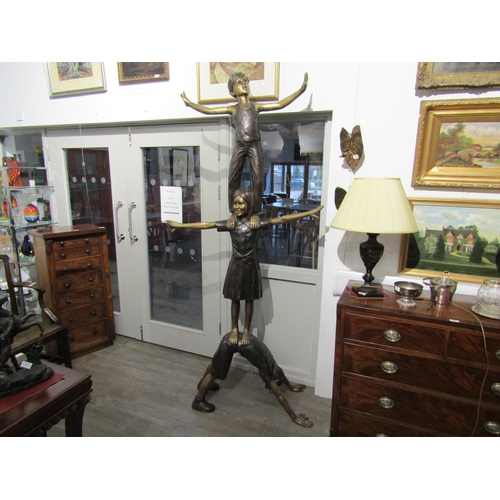 6082 - A bronze sculpture of three children balancing on each other, 222cm tall approx     (C)
