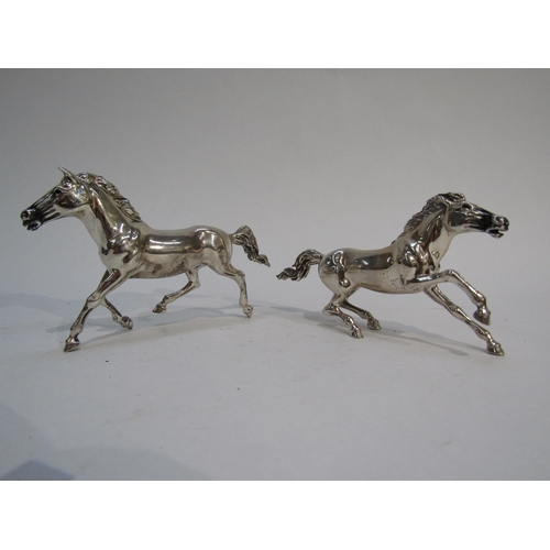 6292 - Two 925 silver galloping horses with import marks for London, makers mark W.S.G., 8.5cm and 7.5cm ta... 