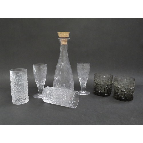 9178 - A collection of Whitefriars drinking glasses and decanter in Icicle and bark textures in clear and s... 