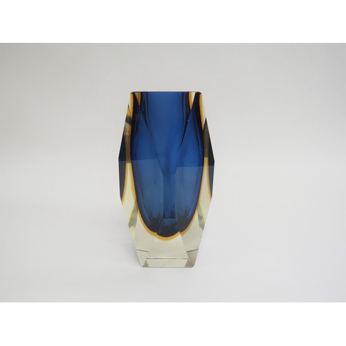 9158 - A Murano Sommerso style facet cut vase in blue and amber, encased in clear. 15.5cm high (fleabite to... 