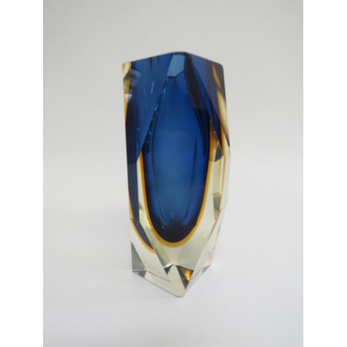 9158 - A Murano Sommerso style facet cut vase in blue and amber, encased in clear. 15.5cm high (fleabite to... 