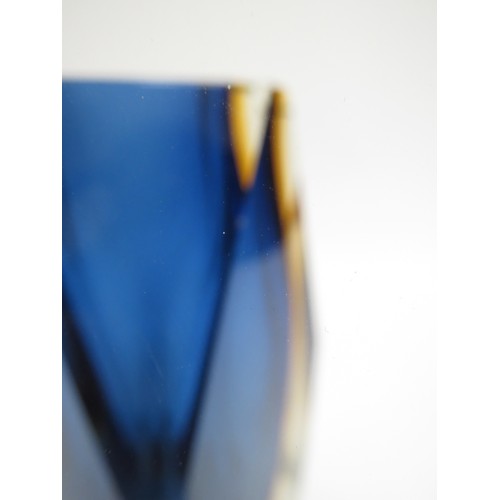 9158 - A Murano Sommerso style facet cut vase in blue and amber, encased in clear. 15.5cm high (fleabite to... 