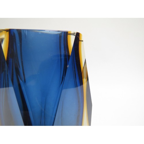 9158 - A Murano Sommerso style facet cut vase in blue and amber, encased in clear. 15.5cm high (fleabite to... 