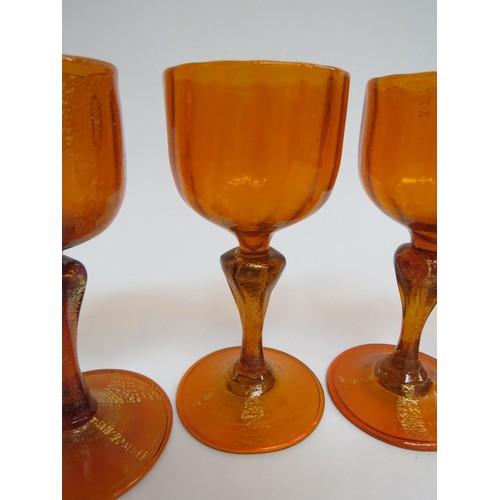 9155 - Four Murano sherry glasses c1960's in orange glass, each with aventurine foil inclusions. 12.5cm hig... 